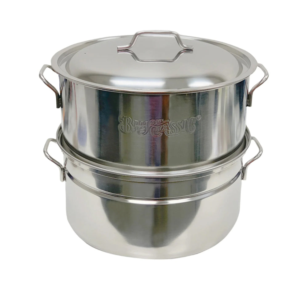 A stainless oyster steamer stockpot on a white background
