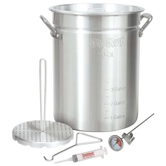 A 30-qt aluminum turkey fryer with a perforated poultry rack, a lift hook, a 12-inch stainless thermometer, and a 1-oz seasoning injector.