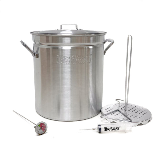 42-qt Aluminum turkey fryer pot with lid, poultry rack and grab hook, thermometer, and seasoning injector on a white background