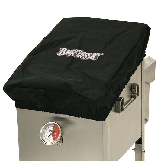 A black canvas lid cover fitted over a 4-gal Bayou Fryer, with the 'Bayou Classic' brand logo visible on the top.
