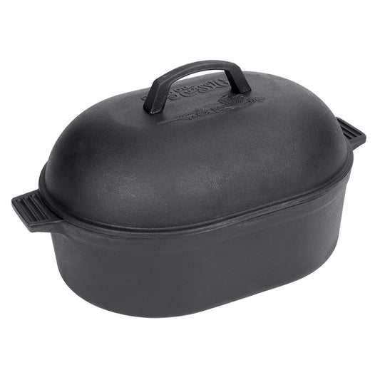 A black cast iron oval roaster with a domed lid and side handles on a white background