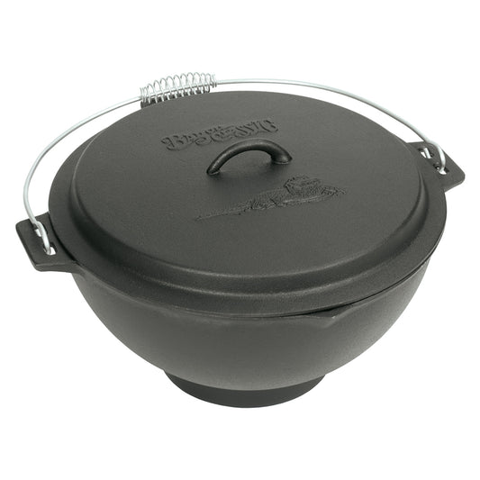 A black cast iron jambalaya kettle with a domed lid and a coil wire handle on a white background
