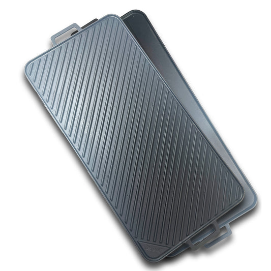 A 28-inch reversible cast iron griddle with a flat side and ribbed grill side on a white background
