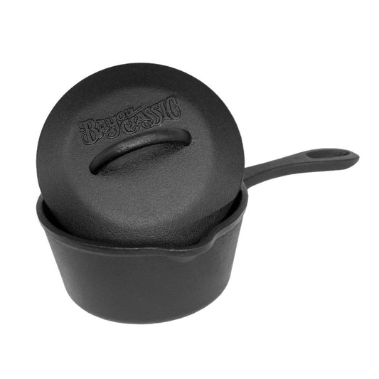 A petite black 1-qt Cast Iron Pot with a domed lid and a handle, on a white background.