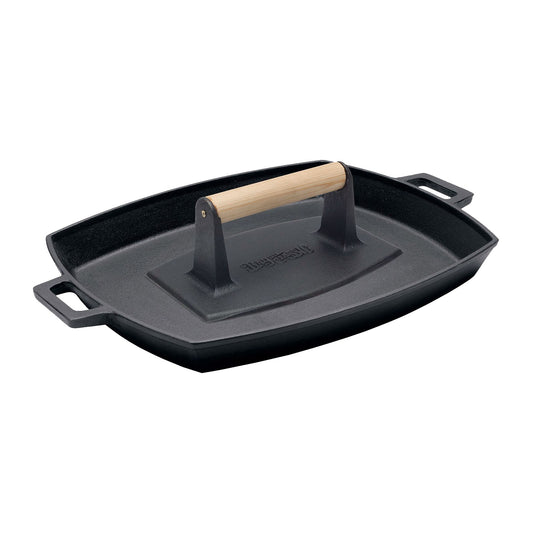 A black cast iron shallow pan with a wooden handle press sitting in the center on a white background.