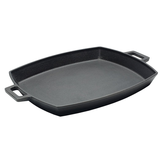 A shallow cast iron pan with two side handles on a white background.