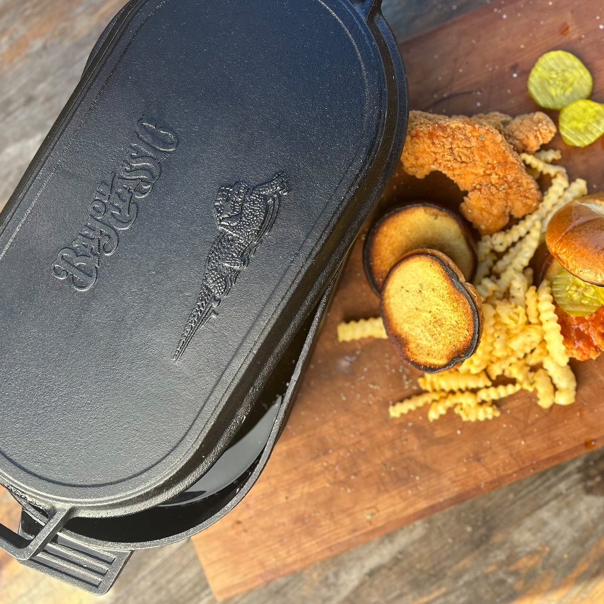 Cast Iron Oval Fryer with fried chicken and french fries