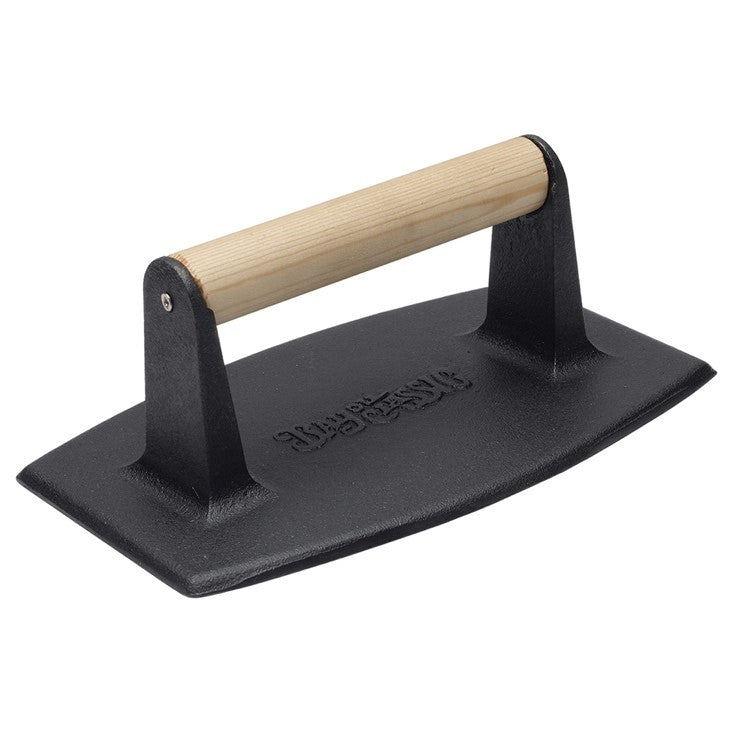 Rectangular shaped cast iron bacon press with a wooden handle on a white background