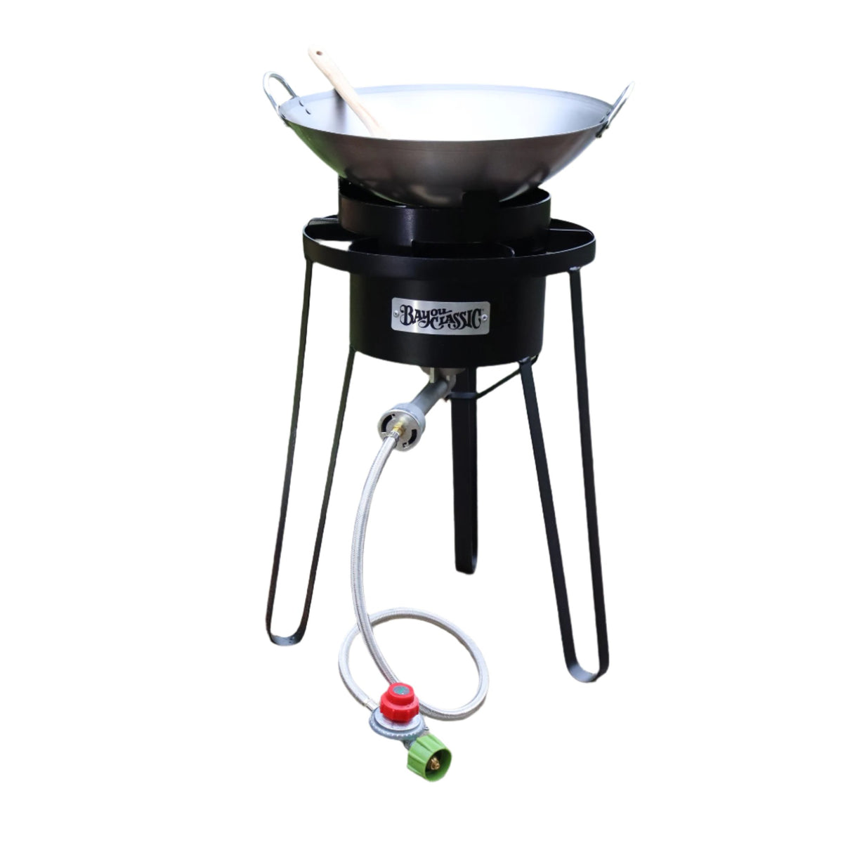 21-in tall high pressure outdoor cooker with a carbon steel wok and a wooden roux spoon on a white background