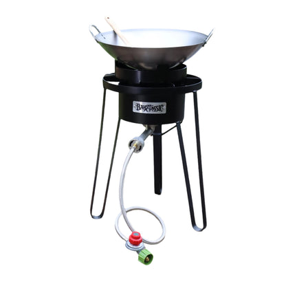 21-in tall high pressure outdoor cooker with a carbon steel wok and a wooden roux spoon on a white background
