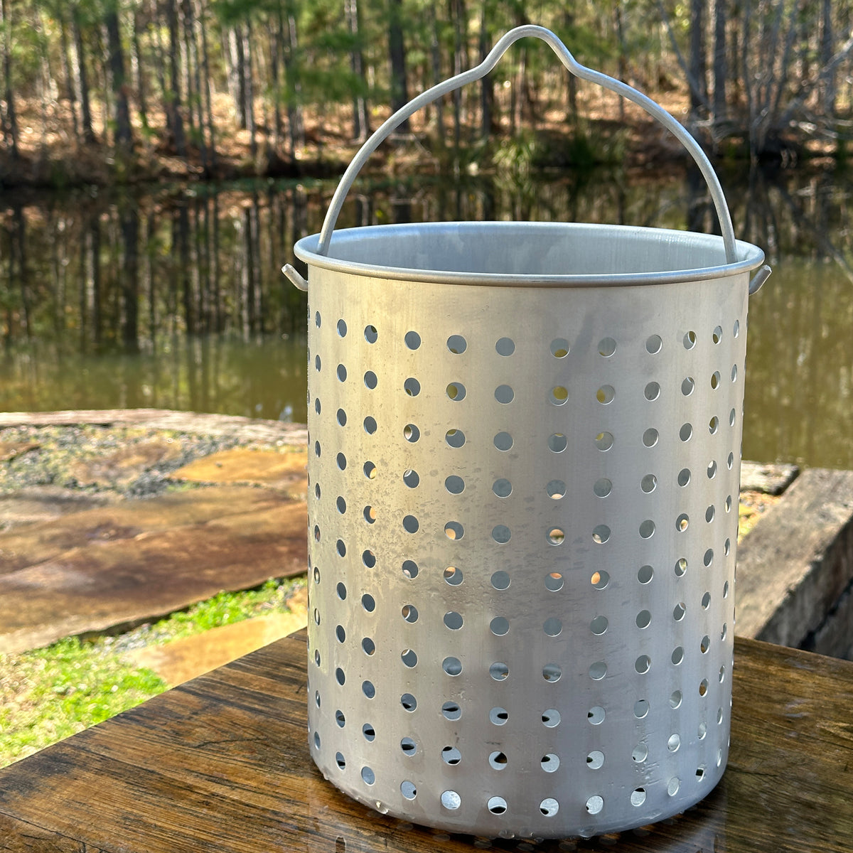 30-qt Accessory Basket outside by a body of water