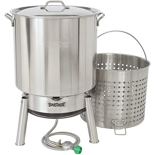 An 82-qt Stainless Bayou Boiler Cooker Kit including a stainless steel stockpot with a vented lid, a boil basket with a helper handle, and a hose and regulator on a white background.