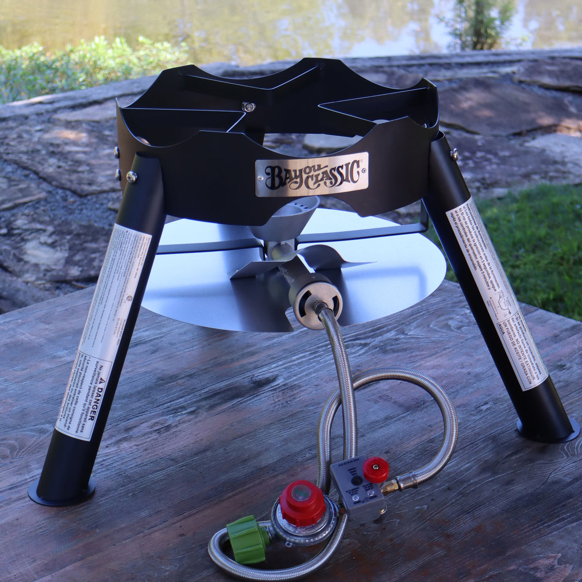 Outdoor Cooker with timer hose in an outdoor setting