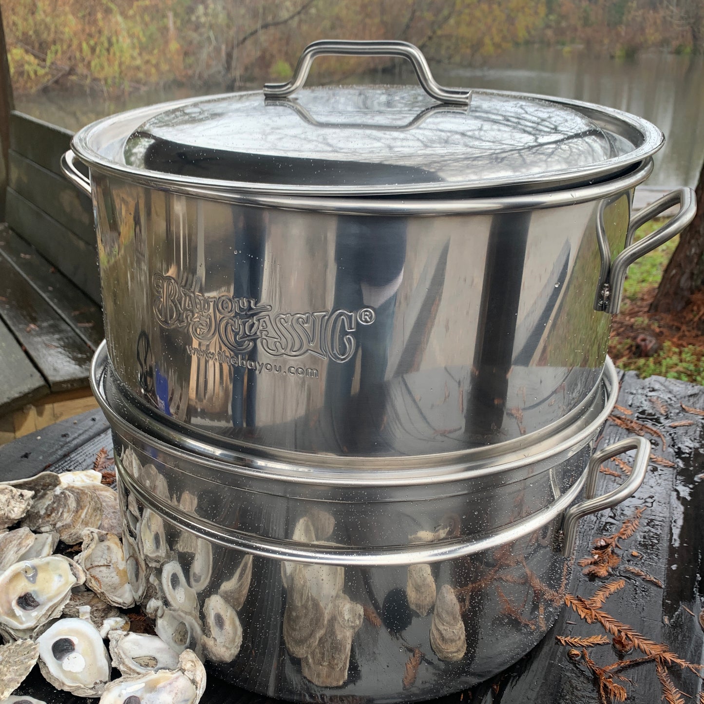Stainless oyster steamer outside by a body of water